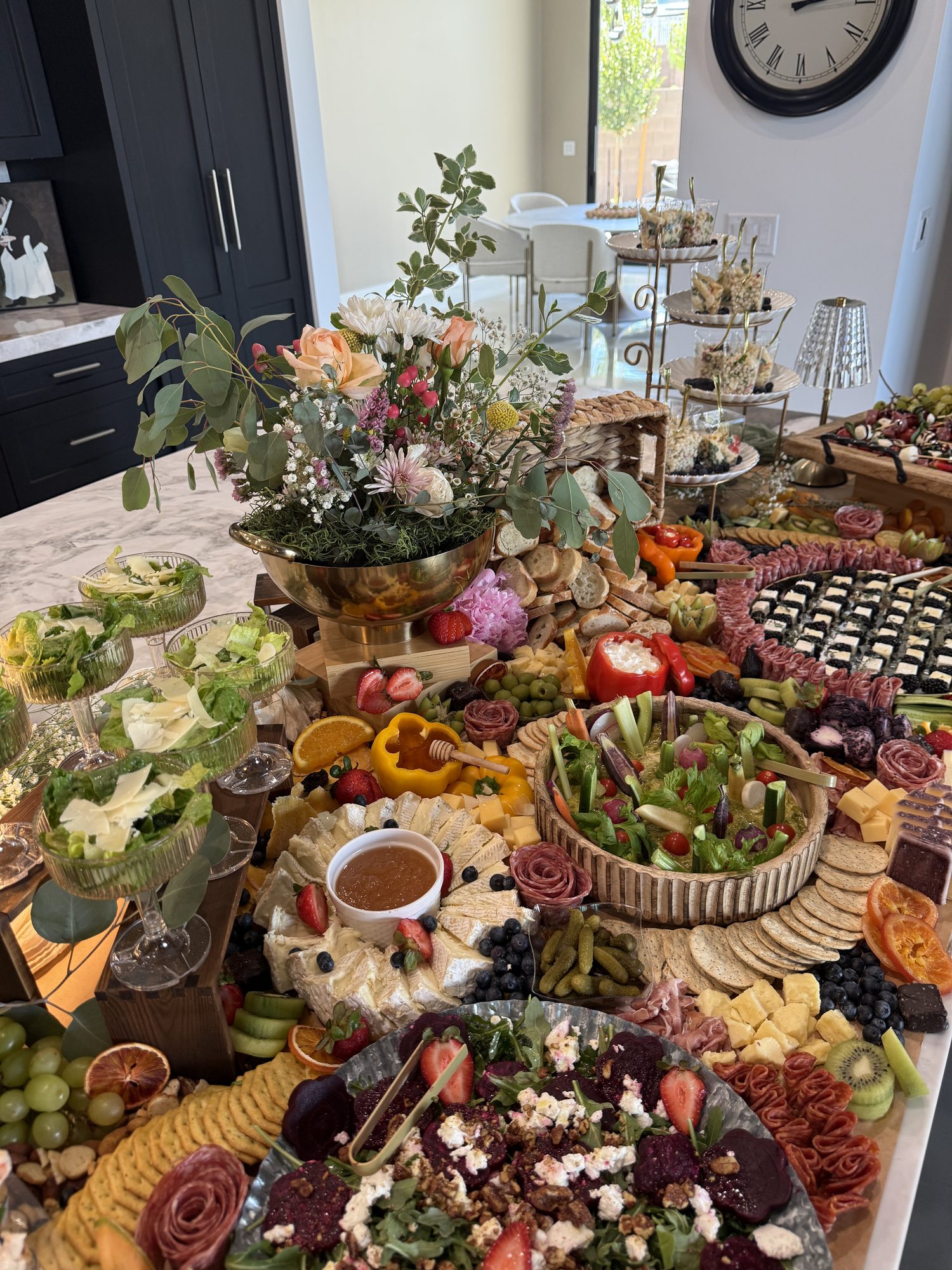 Grazing table styled with fresh florals