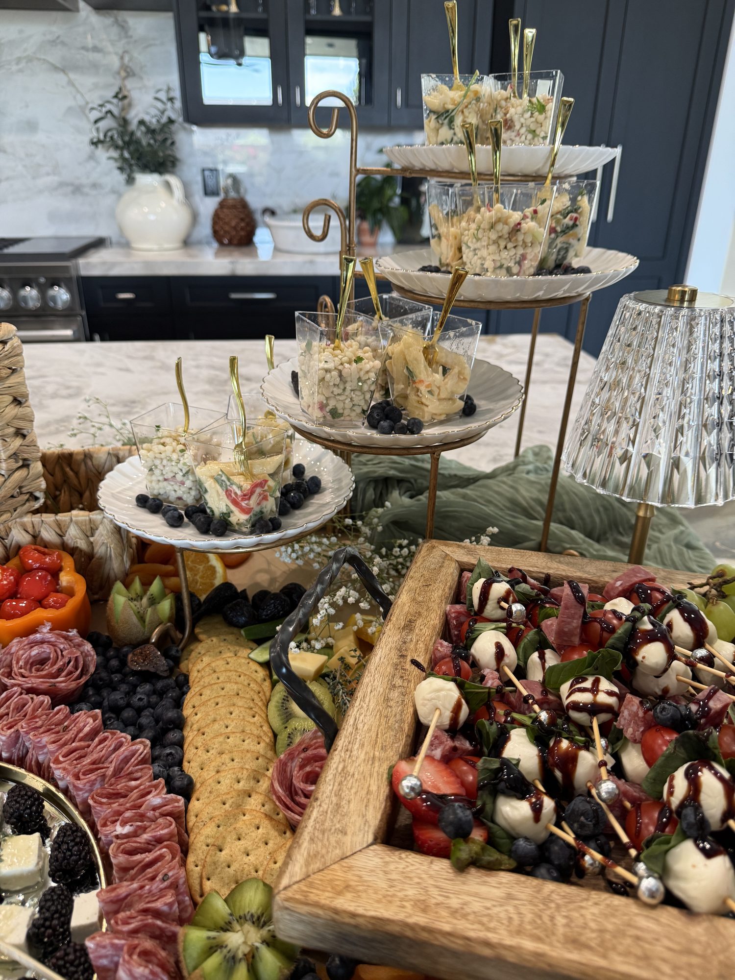 Individual charcuterie cups on tiered stands